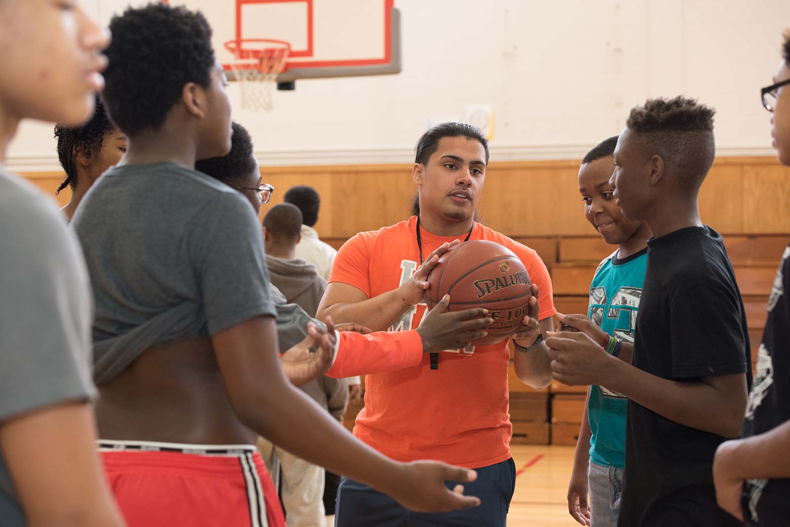 physical education teacher instructing young students