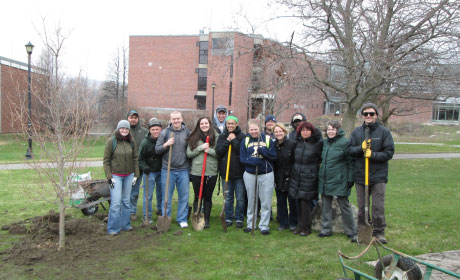 Group photo of students planting trees on arbor day