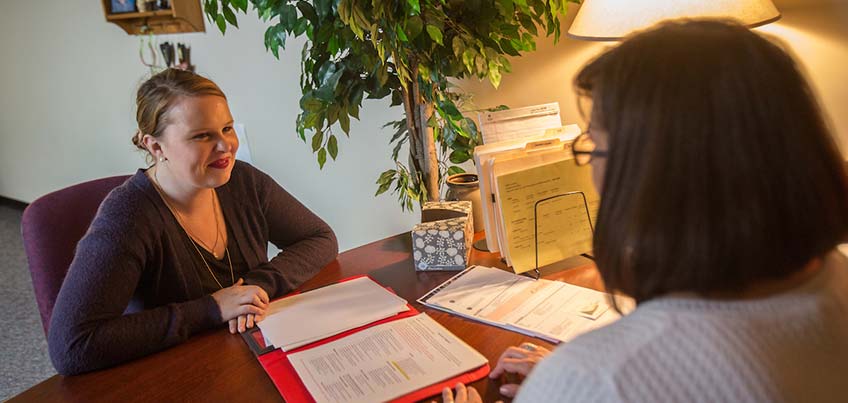 Student meeting with the Financial Aid director