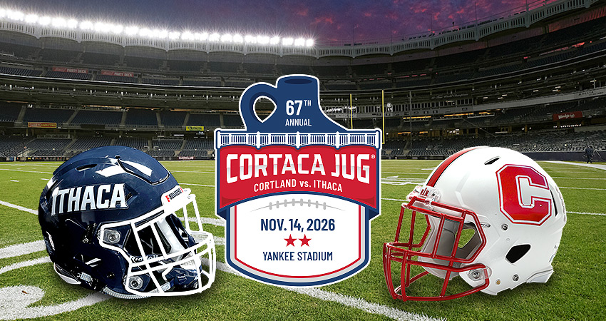 Ithaca and Cortland football helmets with 2026 Cortaca Jug logo in the middle, with Yankee Stadium football field in the evening in the background