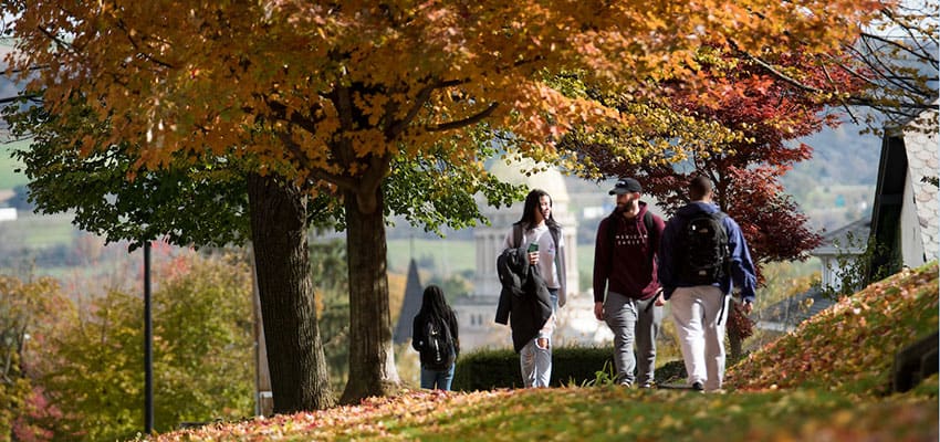 Students walking up the hill outside of Miller Building