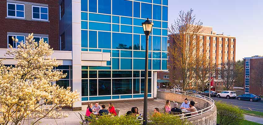 Students sitting outside of Glass Tower Hall