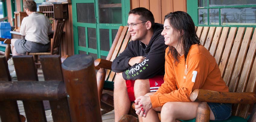 Students hanging out on Antler's porch