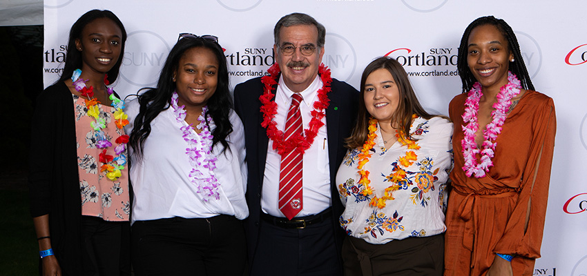 President Bitterbaum poses with four students at Senior Send-Off