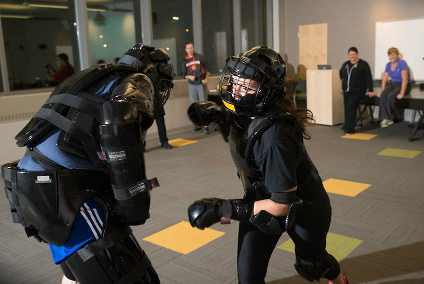 Student participating in self defense class