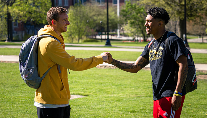 Students fist bump