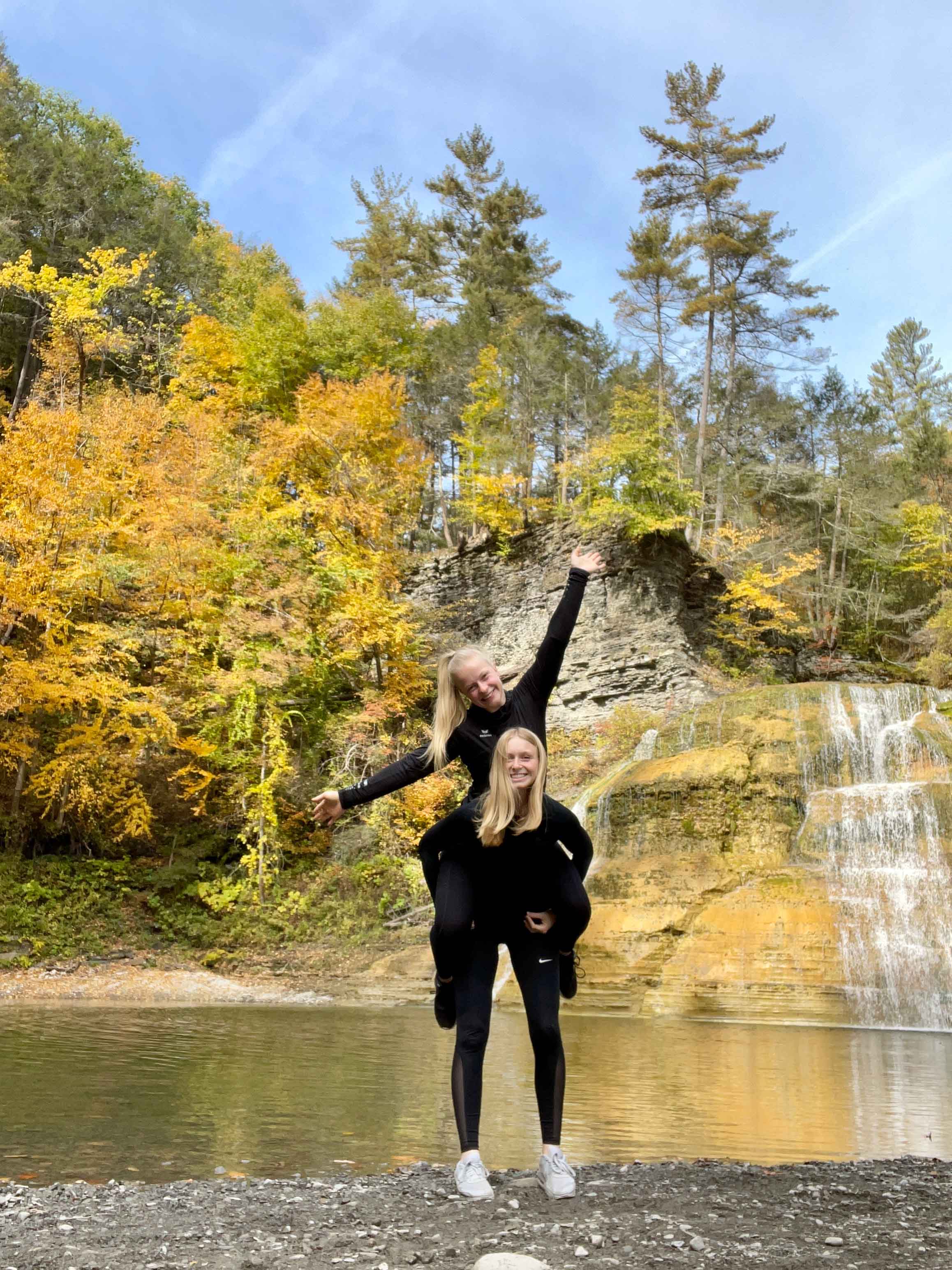 Student pictured near waterfall at Enfield Creek