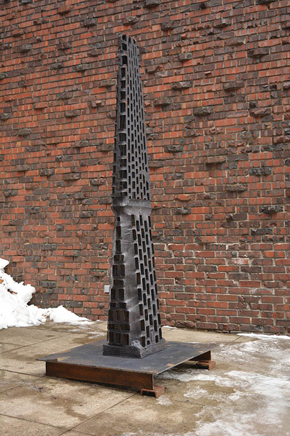 View of the outside of the Dowd Fine Arts Center, southeast entrance featuring cast iron sculpture by Vaughn Randall, professor of sculpture, Art and Art History Department.