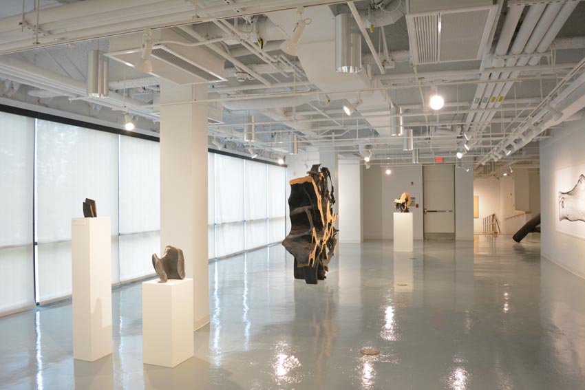 View into the central gallery at Dowd Gallery featuring sculptural objects produced by Ithaca-based sculptor Jack Elliott.