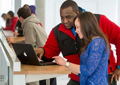 Students working together at the "charge bar" in Bowers Hall