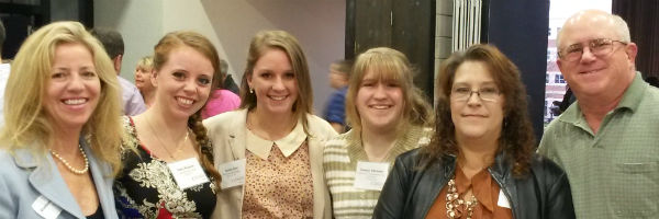 Louisa Frick, Casey Knutson and Katelyn Schroeder together with family members at the President's List Reception