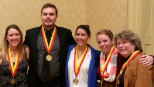 Lyndsney Dolan-King, Peter Rakowsky, Rachel Miller and Casey Knutson together with Sharon Steadman, Vice-President of the SUNY Cortland Zeta Xi Chapter of the Phi Beta Delta Honor Society